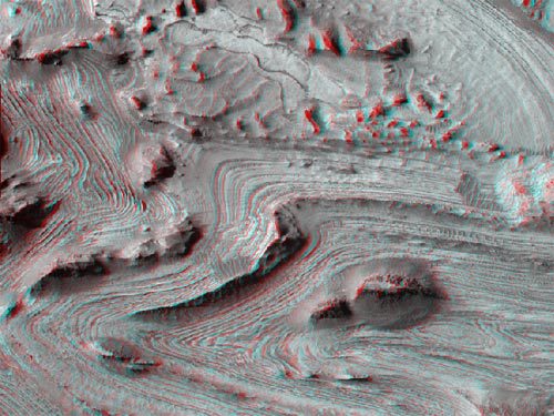 This steep depression is a bit more than 800 km long and it's one of the two large canyons that form the Valles Marineris canyon system which is the largest canyon in the SOLAR SYSTEM