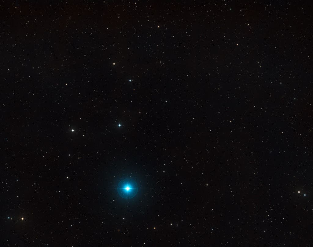 An image taken through red and blue filters of the. The object itself lies very close to the centre and is not visible in this picture, but many other, much closer, galaxies are seen in this wide-field view that spans about three degrees of sky.  (c)ESO and Digitized Sky Survey 2. Acknowledgment: Davide De Martin