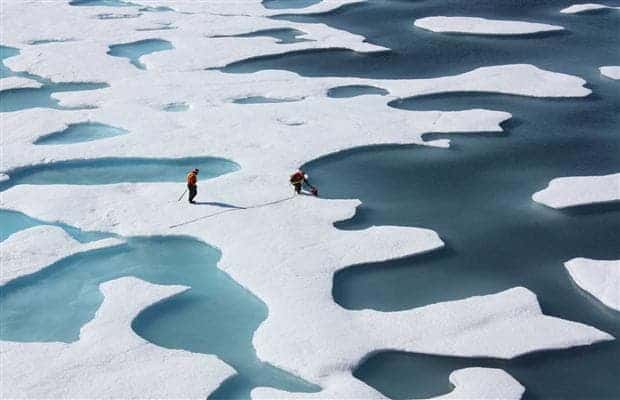 Undated handout photo shows NASA scientists collecting data from thawing Arctic ice during the U.S. agency's ICESCAPE mission in July. (c) Kathryn Hansen, NASA