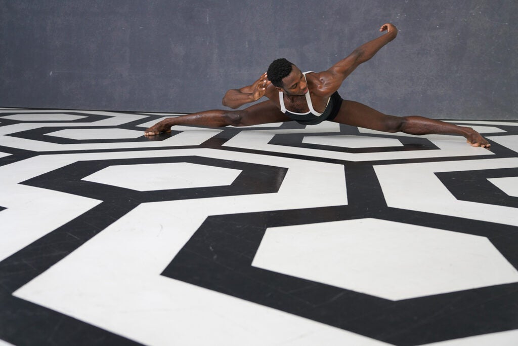 dancer on black and white geometrical floor