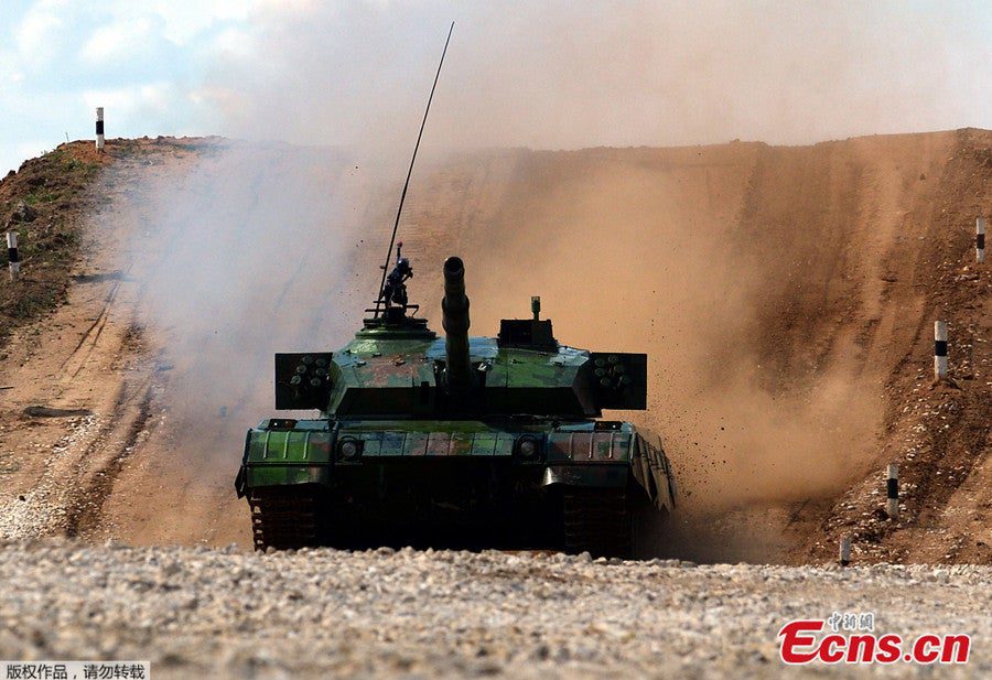 A ZTZ-96A MBT makes the rounds in Alabino, Russia. The Chinese participation in this year's Tank Biathlon is part of a trend in hiigher Chinese military to military exchanges every where from Hawaii to Russia to Africa and the Middle East.