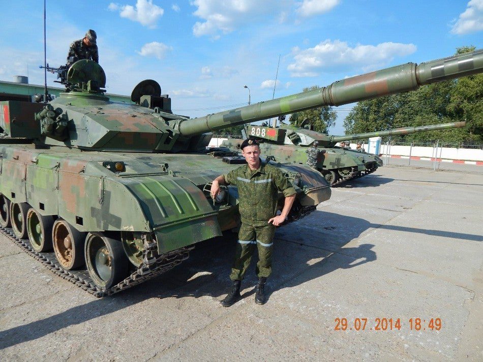 A Russian soldier takes a photo op with a Chinese ZTZ-96A main battle tank just as the Chinese delegation arrives in late July for this month's Biathlon.