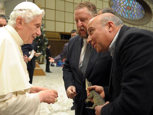 This is a picture of the Pope meeting a rare baby Cuban crocodile. If you need more context, you can find it <a href="http://news.nationalpost.com/2012/01/11/endangered-cuban-crocodile-meets-the-pope/">here</a>, but really, the picture kind of says it all.