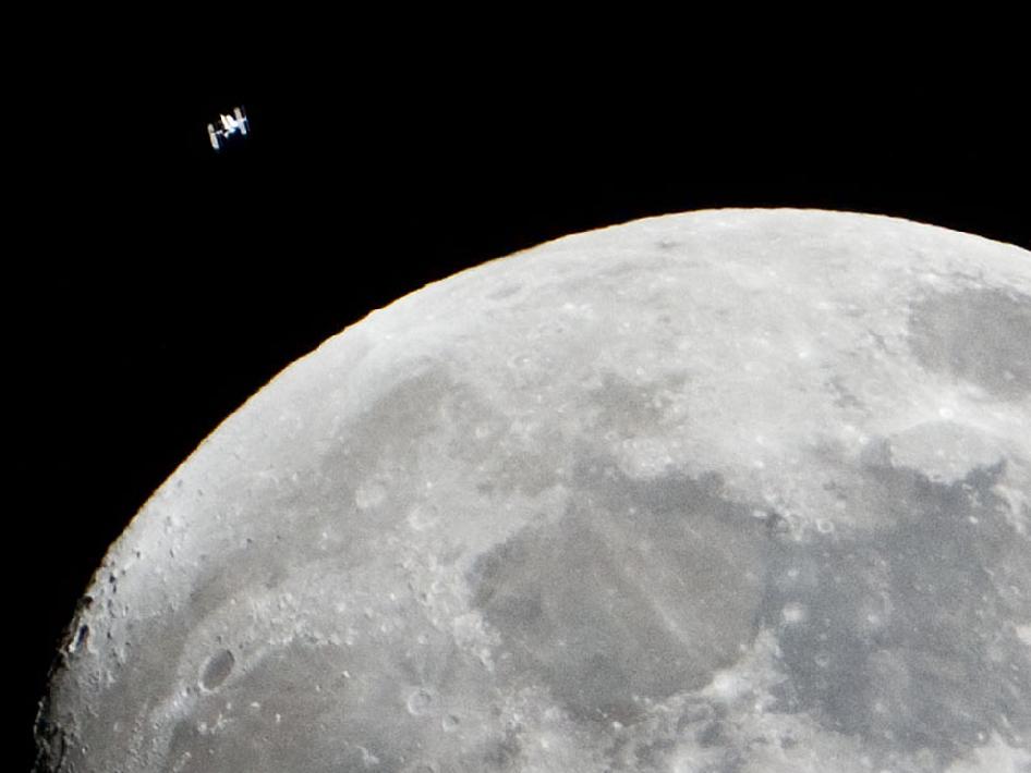 We've never seen an image quite like this: the International Space Station flying in the skies over Houston, in the same shot as the moon. See it bigger <a href="http://www.nasa.gov/multimedia/imagegallery/image_feature_2147.html">here</a>.