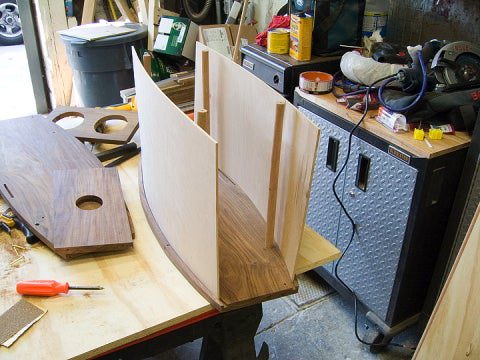 Bent 1/8-inch maple slid into router slots to form the body of a wheeled movie projector.