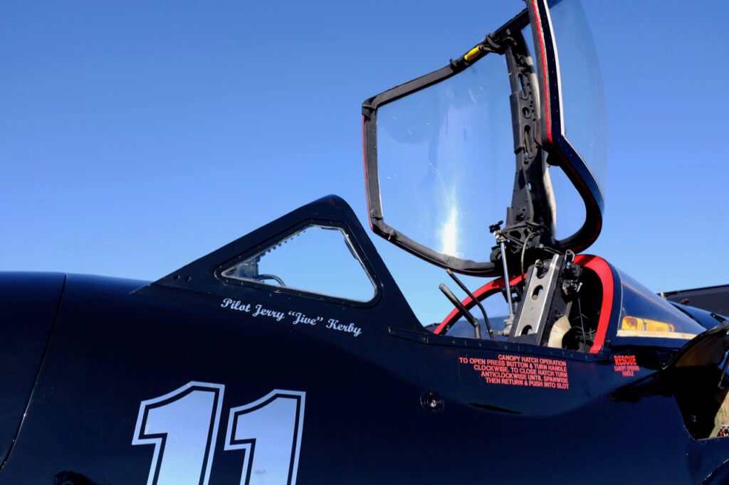 airplane with open cockpit hatch