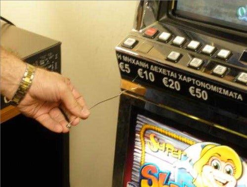 In 2009, a hacker was caught after he installed a program that took over the credit meter on a slot machine. after deliberately jamming the machine by sticking his finger in the payment slot, he called a casino tech to fix it. With the machine open, the hacker peered inside to locate the input-output slot on its computer. Once the tech left, the hacker deftly inserted a wire into the slot through a gap between the lower and upper doors of the machine. He then plugged in a chip with a program that gave him 50 credits every time he punched a button connected to the chip.