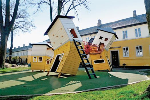 A crashed plane, the belly of a whale and topsy-turvy houses conjure entire worlds. In these wood and metal spaces, playing becomes a form of storytelling: mounting rescue missions, balancing on wings, and trying not to fall into the sea (or sandbox).