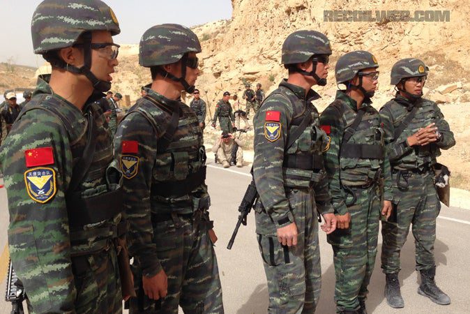 Chinese special forces from the People's Armed Policy get ready in 32C heat at the Jordanian Desert.