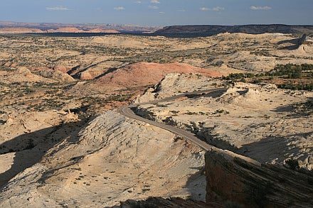 Utah Highway 12 Scenic Byway winds smack dab through the middle of Navajo sandstone outcroppings in the Grand Staircase-Escalante National Monument, north of the Coyote Buttes area in southeast Utah. The Navajo sandstone was deposited on a Triassic-Jurassic desert during the Mesozoic Era—the "Age of Dinosaurs."