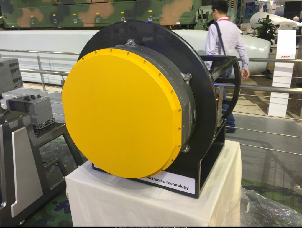 JF-17 Fighter China Pakistan Zhuhai 2016 KLJ-7A AESA Radar on display with a man walking behind it