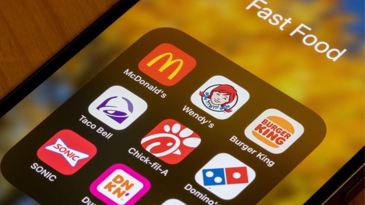 Portland, OR, USA - Dec 6, 2021: Assorted American fast food restaurant apps are seen on an iPhone - McDonald's, Wendy's, Burger King, Taco Bell, Chick-fil-A, Domino's, SONIC, Dunkin', and Subway.