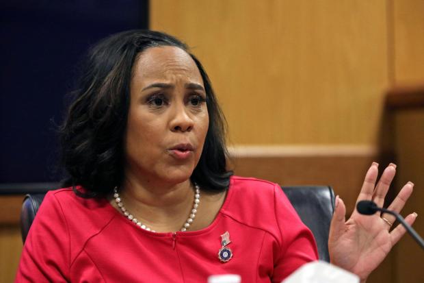 Fulton County District Attorney Fani Willis testifies during a hearing on the Georgia election interference case, Thursday, Feb. 15, 2024, in Atlanta. The hearing is to determine whether Willis should be removed from the case because of a relationship with Nathan Wade, special prosecutor she hired in the election interference case against former President Donald Trump. (Alyssa Pointer/Pool Photo via AP)