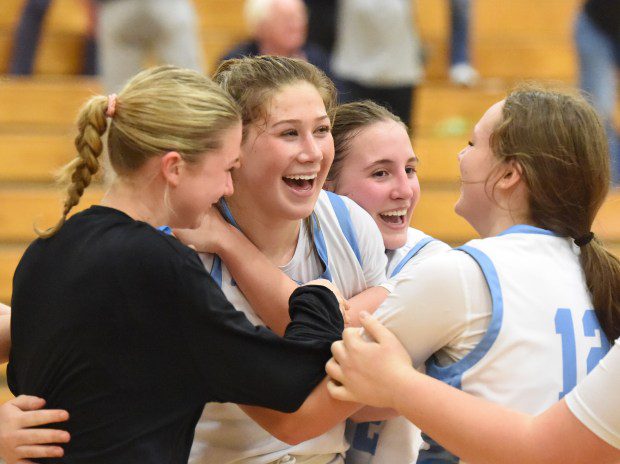 North Penn's Caleigh Sperling, 4, celebrates with teammates after her buzzer-beating shot in overtime gave the Knights a 56-54 victory over North Allegheny in the PIAA-6A second round on Tuesday, March 12, 2024 at Bald Eagle Area High School. (Mike Cabrey/MediaNews Group)