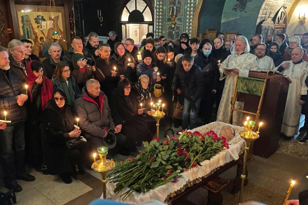 FILE - Relatives and friends pay their last respects at the coffin of Russian opposition leader Alexei Navalny in the Church of the Icon of the Mother of God Soothe My Sorrows, in Moscow, Russia, on Friday, March 1, 2024. Navalny's death at age 47 at an Arctic prison where he was serving a 19-year sentence on extremism charges caused global outrage. (AP Photo, File)