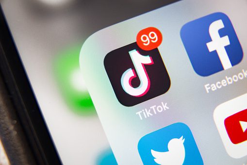 TikTok and Facebook application  on screen Apple iPhone XR