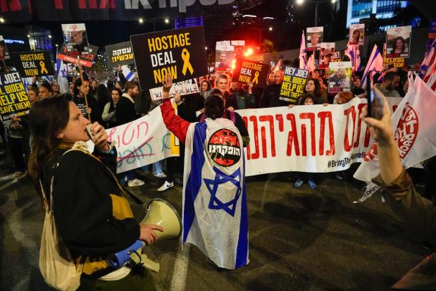 Friends and relatives of the Israeli hostages held in the Gaza Strip by Hamas attend a rally calling for their release, in Tel Aviv, Israel, Saturday, March 9, 2024. With each passing day, the relatives of hostages in Gaza face a deepening despair. (AP Photo/Ariel Schalit)