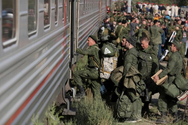 FILE - Russian recruits take a train at a railway station in Prudboi, Volgograd region of Russia, Sept. 29, 2022. As Vladimir Putin heads for another six-year term as Russia's president, there's little electoral drama in the race. What he does after he crosses the finish line, however, is what's drawing attention and, for many observers, provoking anxiety. Probably the most unpopular move he could make at home would be to order a second military mobilization to fight in Ukraine. (AP Photo/File)