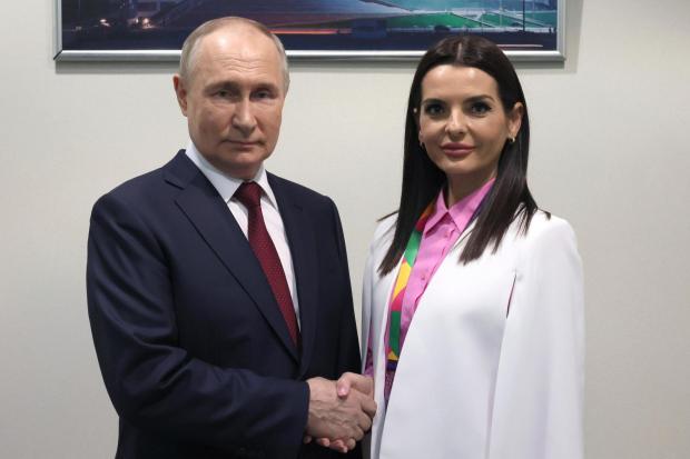 FILE - Russian President Vladimir Putin and Yevgenia Gutsul, the head of Moldova's autonomous region of Gagauzia, pose for a photo during the World Youth Festival at the Sirius Park of Science and Art outside Sochi, Russia, Wednesday, March 6, 2024. As Putin heads for another six-year term as Russia's president, there's little electoral drama in the race. What he does after he crosses the finish line, however, is what's drawing attention and, for many observers, provoking anxiety. The country of Moldova is increasingly worried about becoming a Russian target. (Mikhail Metzel, Sputnik, Kremlin Pool Photo via AP, File)