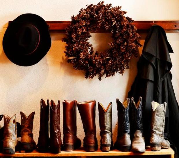 RED FEATHER LAKES, CO - DECEMBER 20: Cowboy boots are lined up for guest, at Sundance Trail Guest Ranch in Red Feather Lakes, December 20 2013. The holiday season in a popular time for guest to visit the ranch. (Photo by RJ Sangosti/The Denver Post)