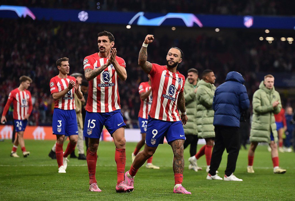 MADRID, SPAIN - MARCH 13: Stefan Savic and Memphis Depay of Atletico Madrid celebrate following the team's victory in the penalty shoot out during the UEFA Champions League 2023/24 round of 16 second leg match between Atl??tico Madrid and FC Internazionale at Civitas Metropolitano Stadium on March 13, 2024 in Madrid, Spain. (Photo by Denis Doyle/Getty Images) (Photo by Denis Doyle/Getty Images)