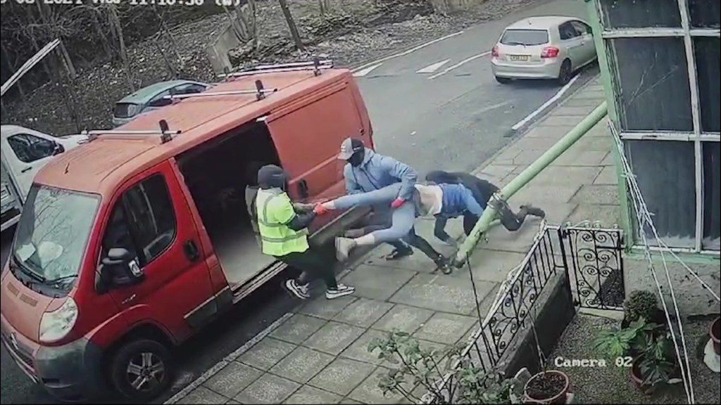 Video grab from footage of a man being being dragged into a van on Westcroft Rd, Bradford at 11.10am on Wednesday 6 2024. Photo released March 14 2024. CCTV footage has caught the terrifying moment a man in Bradford was apparently kidnapped in broad daylight.The footage, taken on March 6, on Westcroft Rd, Bradford at 11.10am on Wednesday 6, shows a red van pulling up outside a house before three men get out and head down and alleyway.Moments later, the three are scene dragging a man into the van as he tries desperately to escape before they make off.