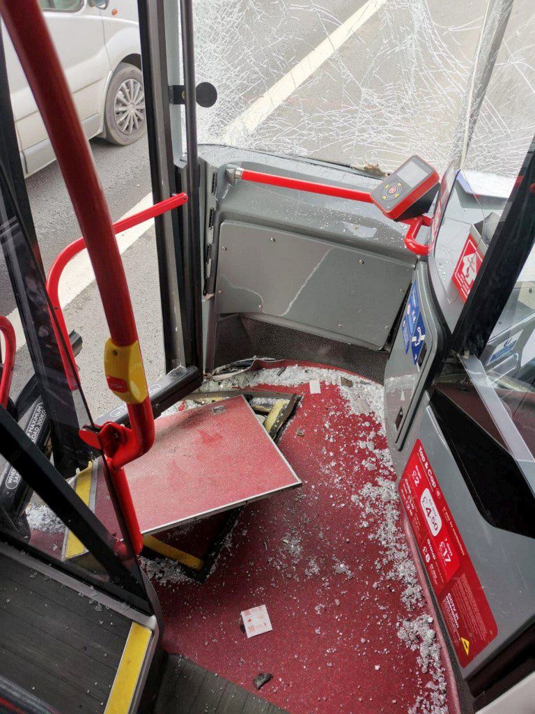 Damage to the bus after shocking dash-cam footage captured the moment a bus ploughed into a car after the driver pulled out into a bus lane. March 13, 2024. Release date - March 14, 2024. Shocking dash-cam footage shows the moment a bus ploughed into a car after an impatient driver pulled out into a bus lane while queuing in busy traffic. Three people had a lucky escape after the bus smashed into the dark-coloured vehicle, which then careered into three other cars in Small Heath, Birmingham. Emergency services were called to the busy dual carriageway following the collision at around 3.40pm yesterday (Wed). A woman, a teenage girl and a boy were treated at the scene by paramedics but incredibly avoided serious injury and there no other reports of anyone being hurt.