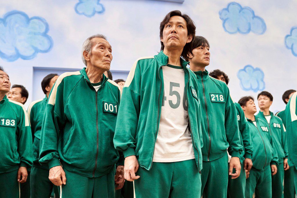 Lee Jung-jae, center, Park Hae-soo, right, and Oh Yeong-soo in a scene from the Korean series Squid Game.