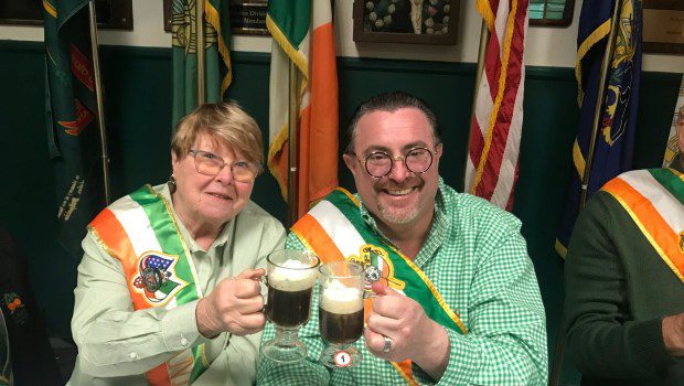 Rae DiSpaldo, president of the LAHO Notre Dame Division and former grand marshal, and Grand Marshal Sean Cullen are seen here tasting the entries. (Photo provided by Pete Hand, AOH parade committee)