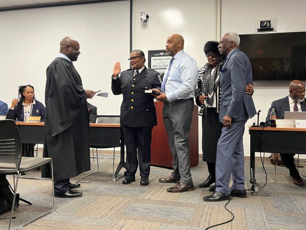 Magisterial District Judge Hakim Jones, left, swears in Norristown Police Chief Jacqueline Bailey-Davis, center, during a Norristown Municipal Council meeting on Jan. 2, 2024. Also pictured, from left, is Bailey-Davis' husband, Thomas Davis, and parents, Pearl Bailey and Martin Edwards Jr. (Rachel Ravina - MediaNews Group)