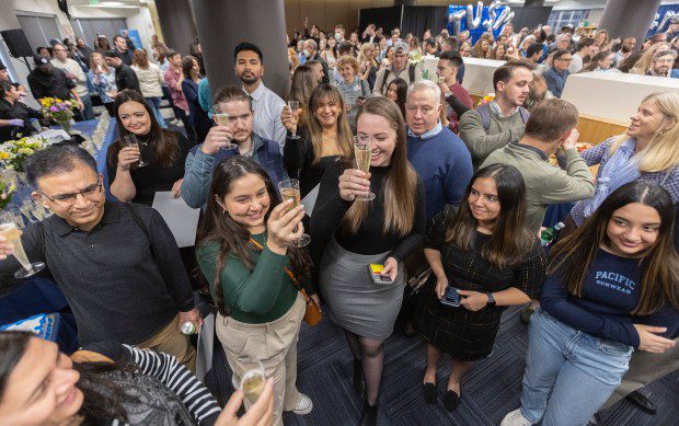 Fourth-year students in Tufts University School of Medicine toast during the schools annual Match Day ceremony. (Matt Stone/Boston Herald)