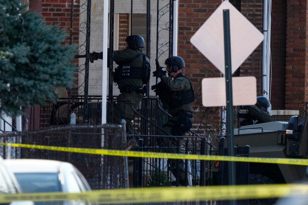 Law enforcement officers enter an empty apartment home, in Trenton, N.J., Saturday, March 16, 2024. A man suspected of killing several people in their Philadelphia-area homes was arrested following a major police response, authorities said. (Matt Rourke/AP)