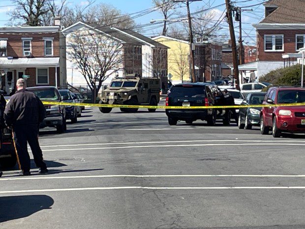 Police vehicles Saturday, March 16, 2024, were on Phillips Avenue near Dexter Street in Trenton. Andre Gordon Jr., the suspect in two shootings in Bucks County that left 3 people dead, was barricaded inside a home and holding hostages, authorities said. (L.A. Parker/The Trentonian)