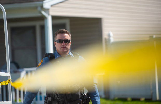 Police officers from the Falls Township Police Department tape off and inspect the scene of a shooting in the Vermillion Hills neighborhood March 16, 2024, in the Levittown section of the township. Andre Gordon shot and killed three people before fleeing to Trenton, police said. (Matthew Hatcher/Getty Images)