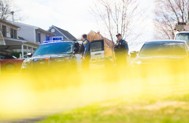 Police officers from the Falls Township Police Department tape off and inspect the scene of a shooting in the Vermillion Hills neighborhood March 16, 2024, in the Levittown section of the township. Andre Gordon shot and killed three people before fleeing to Trenton, police said. (Matthew Hatcher/Getty Images)