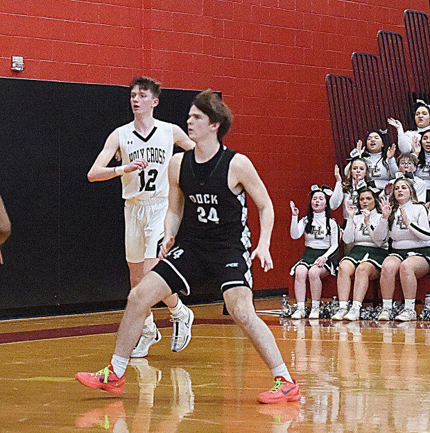 Dock Mennonite's Brian Dorneman, 24, positions himself toward the basket in front of Holy Cross's Matt Lyons during the PIAA-2A quarterfinals at Easton Area Middle School on Saturday, March 16, 2024. (MediaNews Group)