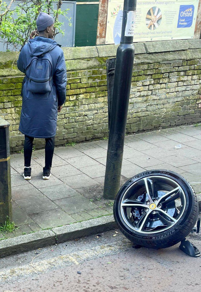 Shocking photos show the aftermath of a crash that wrecked a quarter-of-a-million-pound Ferrari. Release date ? March 17, 2024. The black supercar was one of two cars involved in the crash in Islington, north London, which saw one of its wheels detached and flung to the opposite side of the road. Photos shared by onlookers show the crumpled car, a Ferrari 296 GTB, with its boot open and missing a wheel, with twisted metal strewn across the road. The vehicle can reach speeds of 62 miles per hours in 2.9 seconds. The crash, which occurred at around 1pm, caused the road to be shut for some time, with buses and cars unable to move. An air ambulance attended the scene and one man was treated at the scene before being rushed to hospital. His injuries are not believed to be life-threatening.