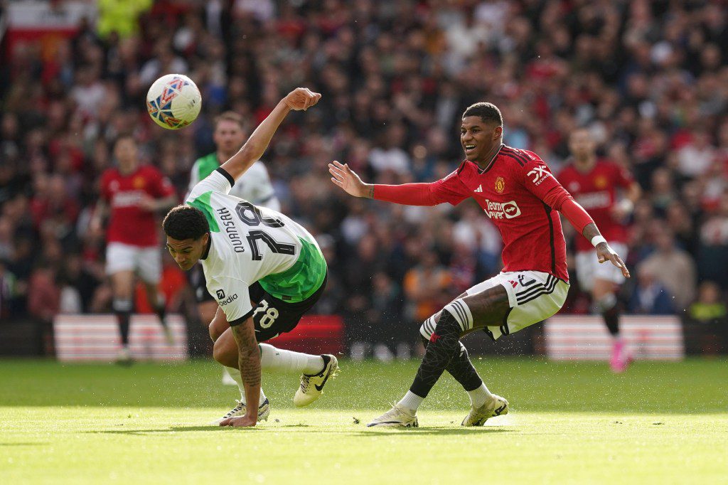 Liverpool's Jarell Quansah (left) and Manchester United's Marcus Rashford battle for the ball during the Emirates FA Cup quarter-final match at Old Trafford, Manchester. Picture date: Sunday March 17, 2024. PA Photo. See PA story SOCCER Man Utd. Photo credit should read: Martin Rickett/PA Wire. RESTRICTIONS: EDITORIAL USE ONLY No use with unauthorised audio, video, data, fixture lists, club/league logos or 