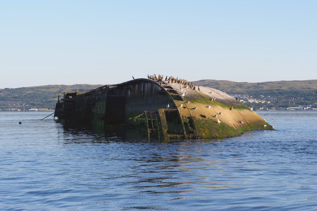 Shipwreck sugar boat at sea on the River Clyde viewed from Firth of Forth Scotland Uk