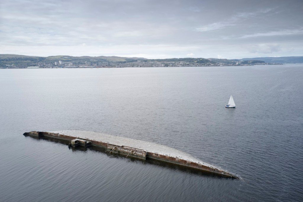 Shipwreck at sea on the Firth of Clyde viewed from Greenock Scotland Uk