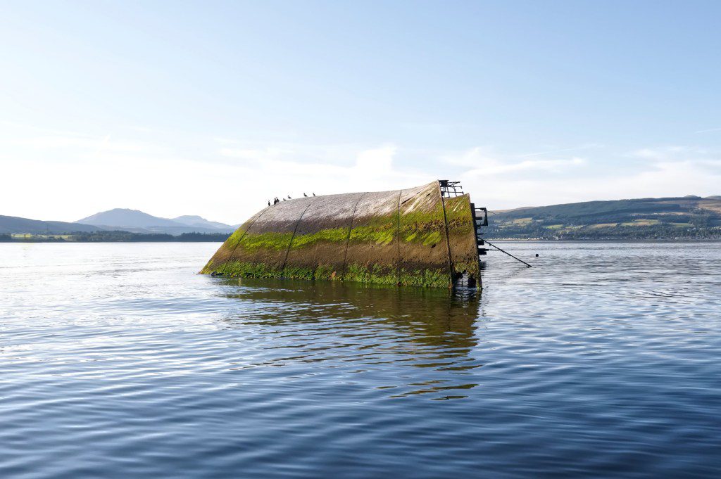 Shipwreck sugar boat at sea on the River Clyde viewed from Firth of Forth Scotland Uk