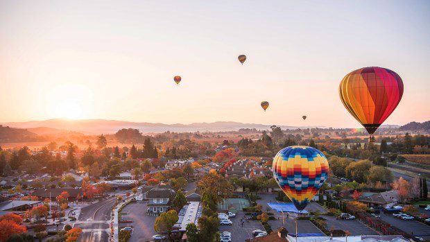 Balloons soar over Napa Valley in the early morning hours. (Courtesy Town of Yountville)