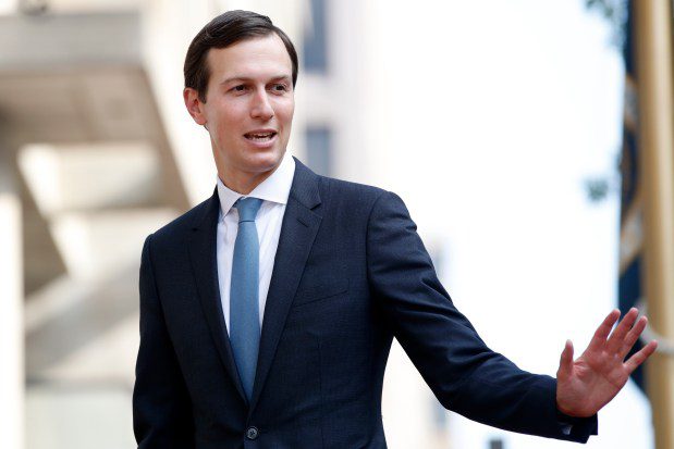 FILE - Jared Kushner waves as he arrives at the Office of the United States Trade Representative for talks on trade with Canada, Aug. 29, 2018, in Washington. Kushner, Donald Trump's former White House adviser and his son-in-law, praised the "very valuable" potential of Gaza's "waterfront property." Kushner in an interview with a Harvard University professor last month suggested that Israel should remove civilians while it "cleans up" the area. (AP Photo/Jacquelyn Martin, File)