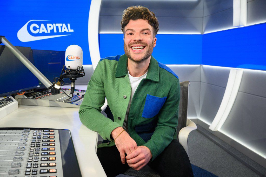 Jordan North sitting at the Capital FM studio