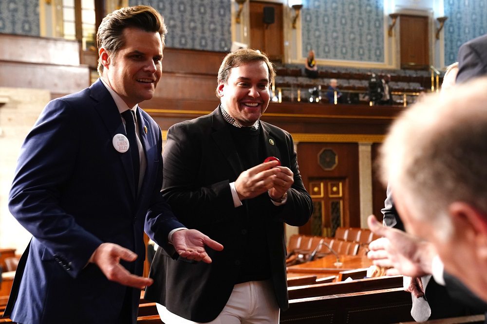 Mar 7, 2024; Washington, DC, USA; Republican Representative from Florida Matt Gaetz (L) and former Republican Representative from New York George Santos (C) chat 