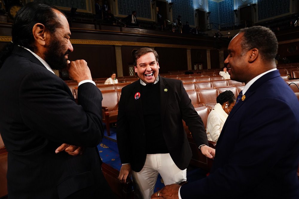 Mar 7, 2024; Washington, DC, USA; Former Republican Representative from New York George Santos (C) chats with Democratic Representatives Al Green from Texas (L) and Joe Negus from Colorado (R)