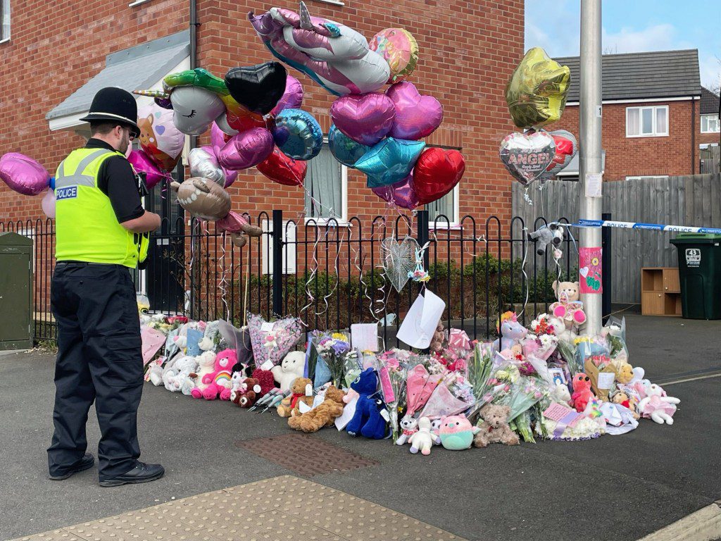 Floral tributes are left at the entrance to Robin Close, Rowley Regis as Jaskirat Kaur, also known as Jasmine Kang, has appeared at Wolverhampton Magistrates' Court, charged with murdering her 10-year-old daughter Shay Kang, whose body was found in Rowley Regis on Monday. Picture date: Wednesday March 6, 2024. PA Photo. See PA story COURTS RowleyRegis. Photo credit should read: Matthew Cooper/PA Wire