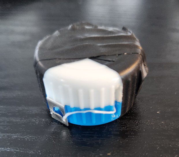 A full spool of dental floss fits easily into the circumference of a contact lens container cover. (Myscha Theriault/TNS)