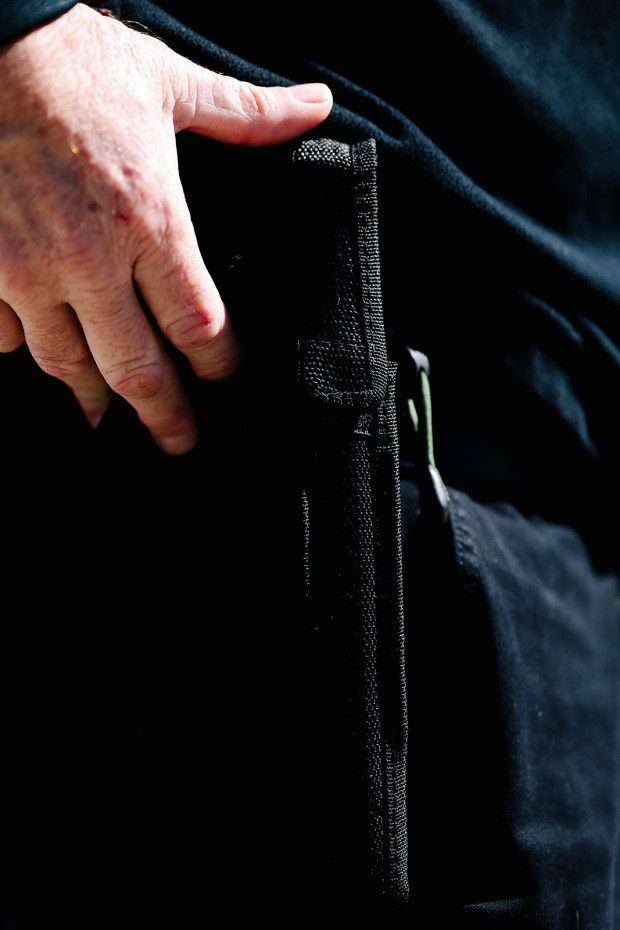 Flash Shelton shows off his tool belt complete with a baton at Todd Longshore Park in Santa Clarita this month. (Dania Maxwell/Los Angeles Times/TNS)