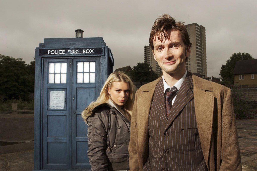 David Tennant as the tenth time lord Doctor Who and Billie Piper as Rose Tyler, standing in front of the tardis